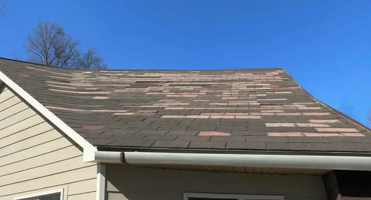 Aging asphalt shingle roof on 1990s ranch home in Eudora, Kansas
