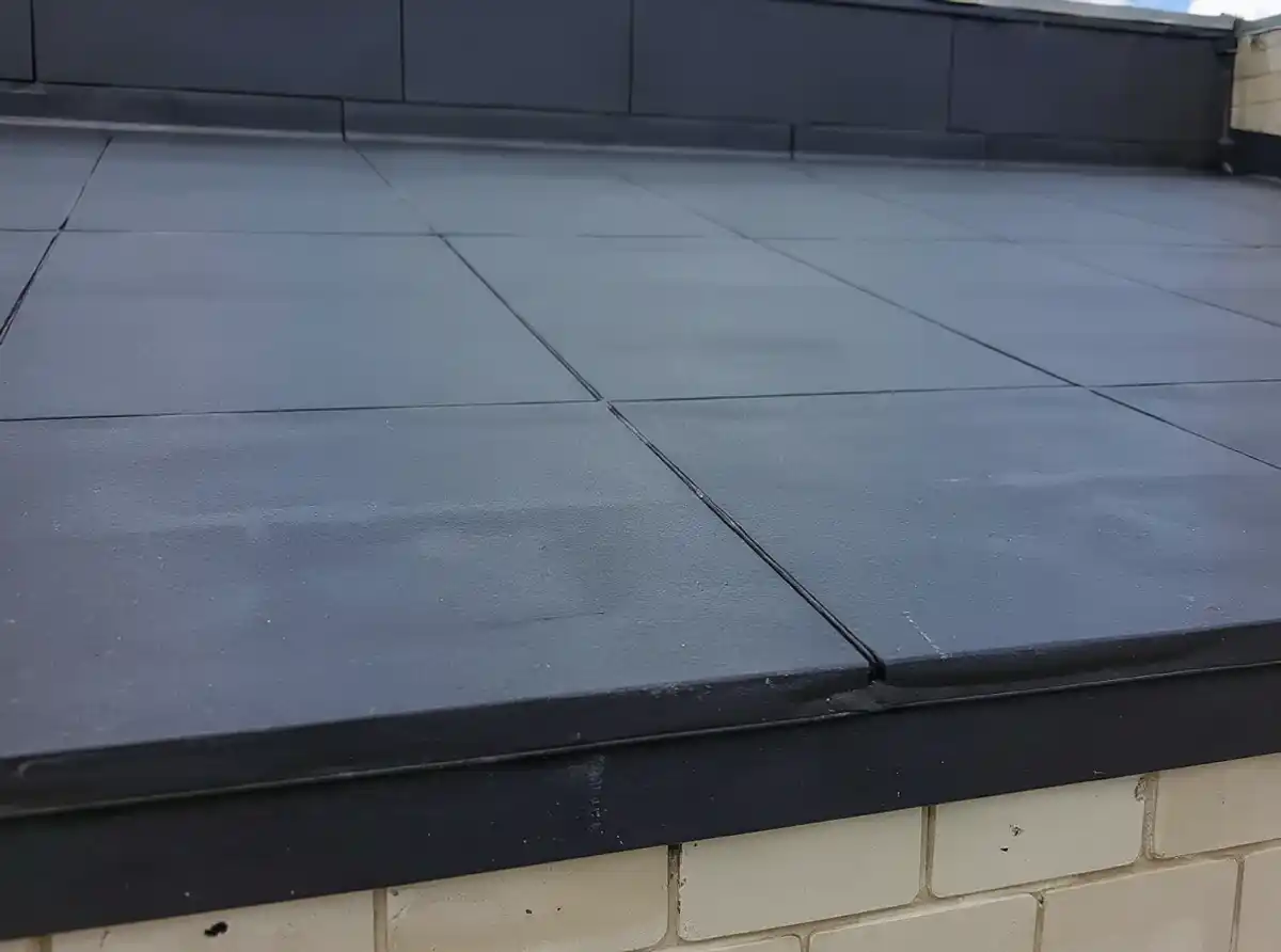 Black EPDM rubber membrane seam and edge termination detail