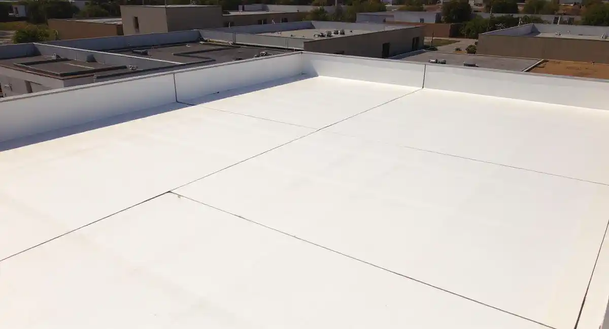 White TPO membrane installed on commercial flat roof with welded seams